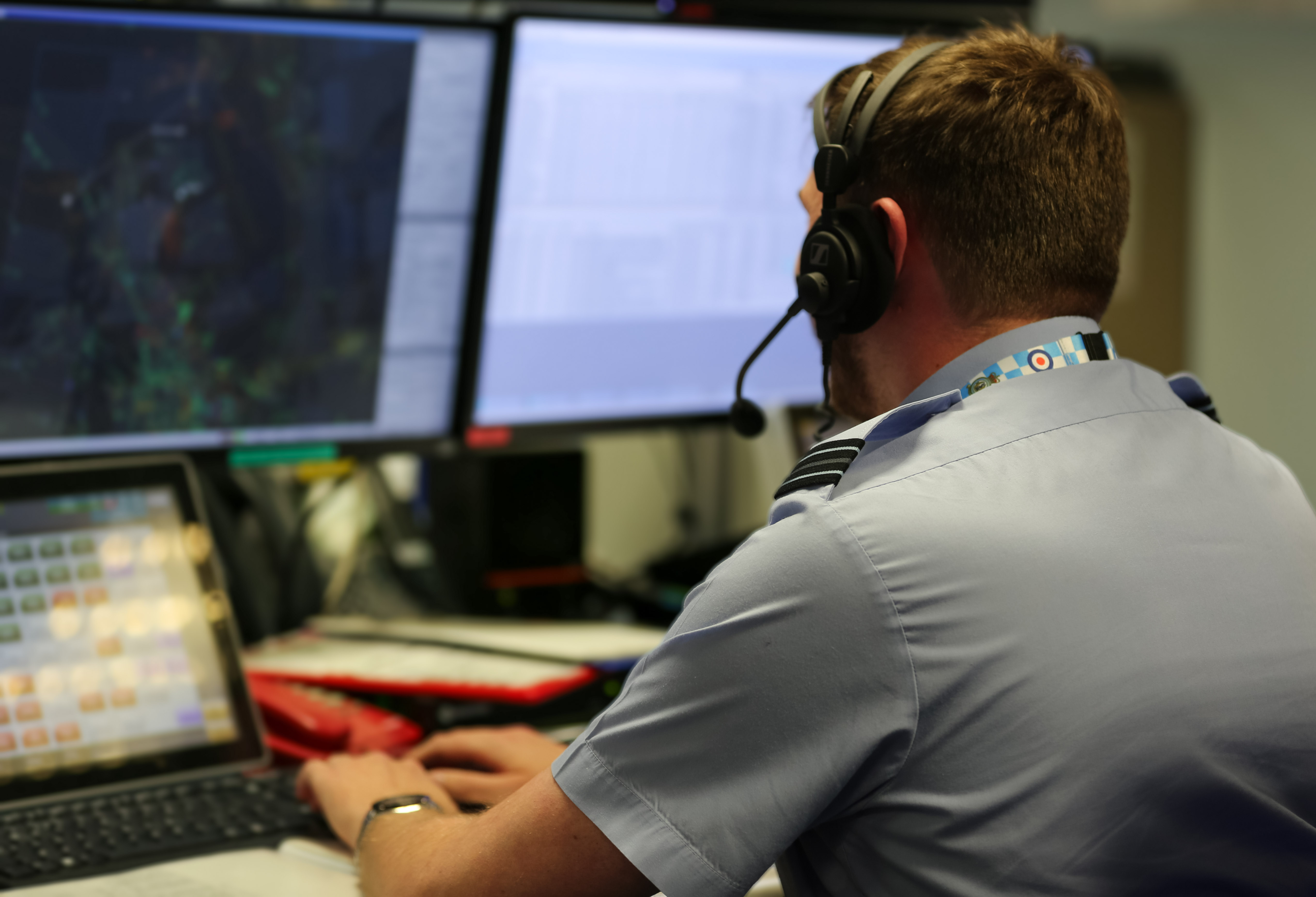 RAF personnel in a control room.